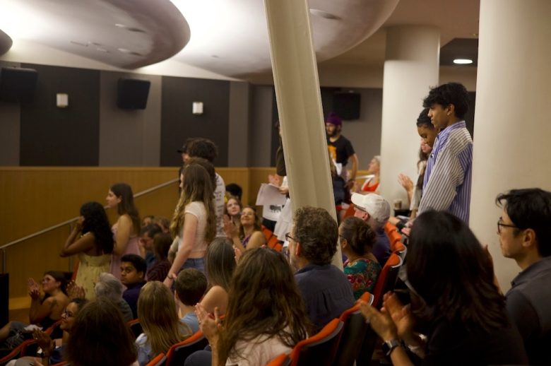 Photo of the High School Filmmakers Workshop students, friends, and family gathered in a theatre-style classroom for their final presentations.